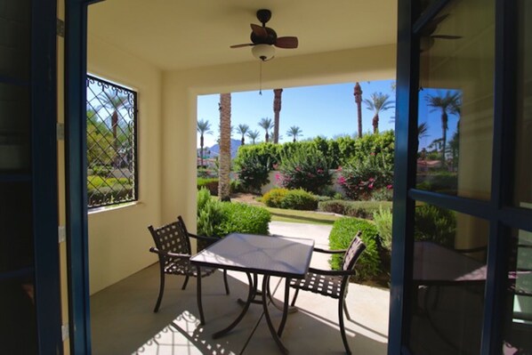 King Suite I private patio overlooks walled-in semi-private "backyard" lawn area