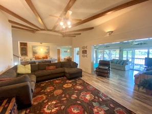 Spacious family room w/plenty of seating open to the sun room, with water views.