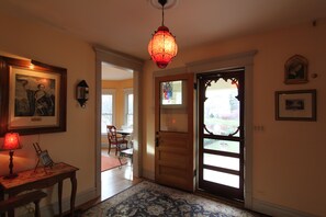 Front entrance hall off of the beautiful front porch. The parlor is off of this.