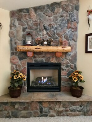 The cheery fireplace will warm you up on a chilly evening.