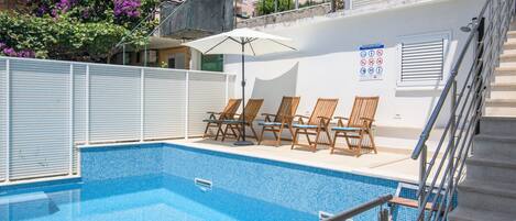 Swimming pool & sun loungers