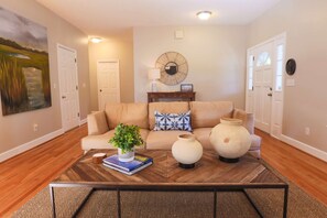 When you enter the front door, you'll find a comfortable living room with hardwood floors.