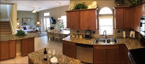 Modern Gourmet Kitchen Open & Inclusive with Main Room- Features Bartop Seating