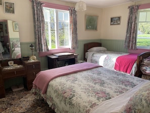 Main bedroom with comfy beds, cotton sheets and woolen blankets
