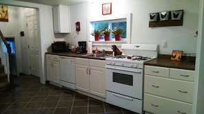 Kitchen with gas stove and dishwasher.