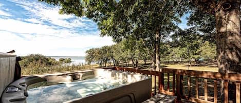 Soak in the hot tub overlooking Lake Whitney!