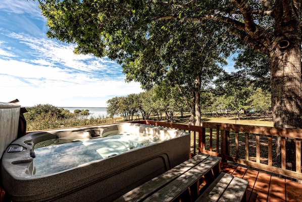 Soak in the hot tub overlooking Lake Whitney!