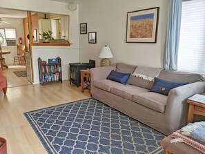 Living room opens up to kitchen and dining space.
