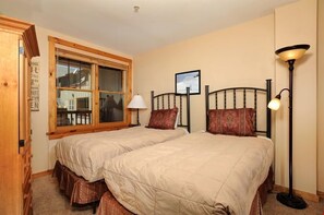 Cozy up in the bedroom. Bedding configurations vary.