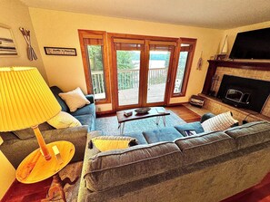 Livingroom with sofa bed and 50" Roku TV.