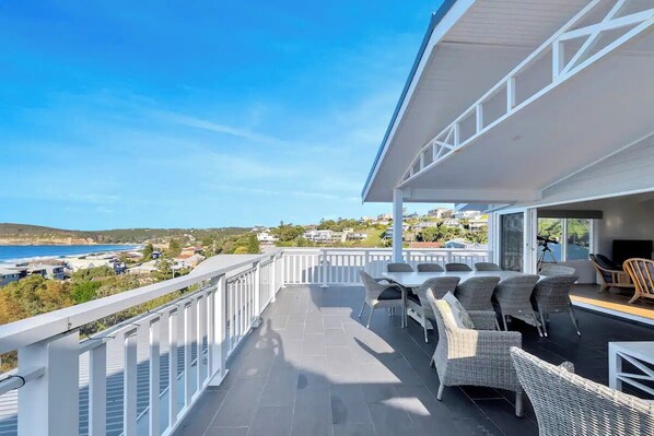 Relax or entertain on the huge top balcony overlooking the beach and ocean.