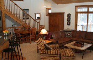 Great Room dining area, stairs to loft