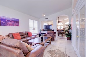 Comfy living room with 55" TV that swivels to kitchen