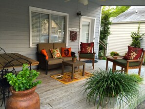 Private porch with a ceiling fan at the Cypress Room