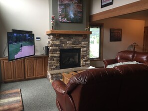 Big screen HDTV and gas fireplace.