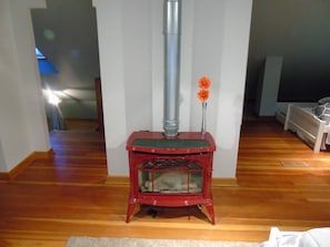 Vented gas fireplace in upper loft