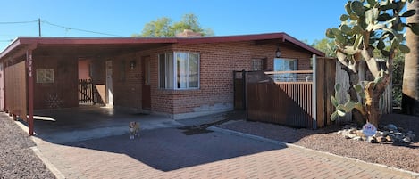 front of house with carport and fenced yard