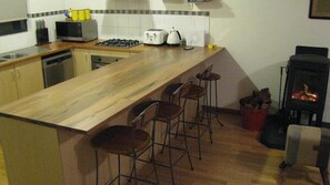 Fully equipped kitchen with casual breakfast bar dining