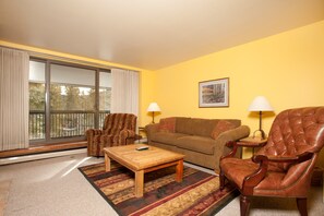 Relax in the spacious living area, complete with comfortable sofas