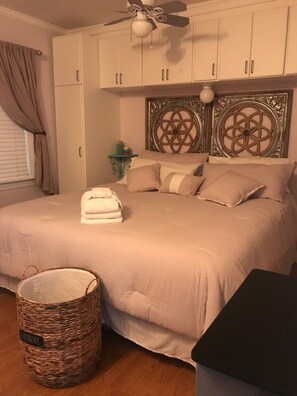 Bedroom with king size bed.  New Comforter.  Flat screen TV.  