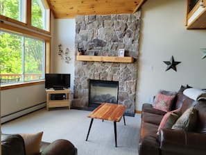 Living Room with gas fireplace and stonework
