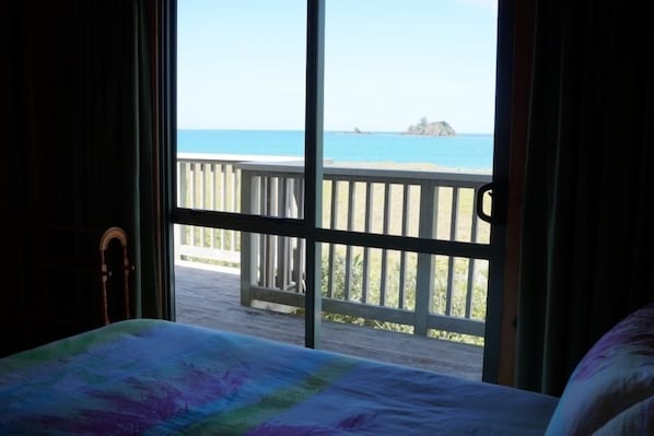 Watch the sun rising over the water from bed in Bedroom 1