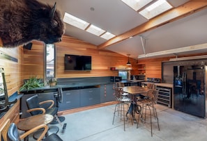 Living Area
(Two Barber Chairs have been replaced with Cowhide Sofa)