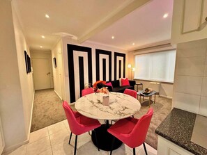 Marble top dining table with striking pink velvet