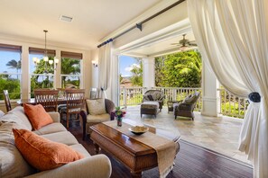 Wall of glass opens to connect Living and Lanai areas.