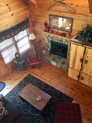 View from above looking down at the living room and fireplace and TV Cabinet