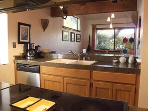 View from living area into kitchen and dining room