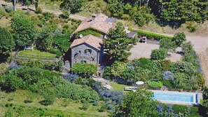 Aerial shot of the house and pool.