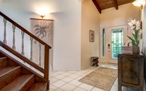 Entry with vaulted ceiling open to upstairs