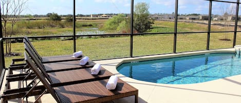 Enjoy the scenic views - plenty of opportunity to sit and relax by the sunny private pool in Florida