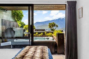 Unwind in a luxury spa with stunning mountain views right next to your bedroom! 