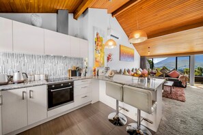 Gourmet Kitchen: Whip up culinary delights with stunning garden and mountain views with all modern appliances!