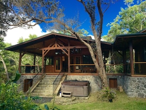 View from the private backyard looking at the front of the house with jacuzzi.