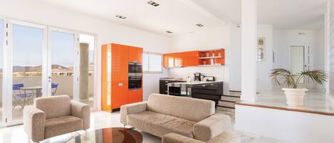 The living room and kitchen! Modern and fully equipped!