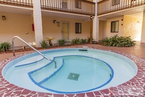The hot tub is right outside the front door in the center of our building.
