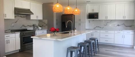 Kitchen with island and stools