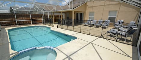 30ft pool and spa set in a large decking area 40ft x 35ft and a covered lanai  