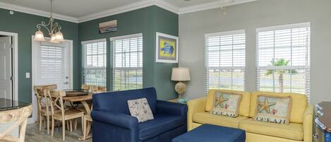 Open living and dining area with natural light shinning in