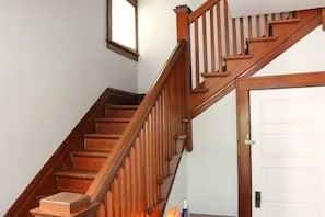 Stairs going up. Notice the 100 year old oak wood trim.