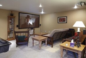 106 Inch HD Theater Room/surround sound, full size futon & couch behind