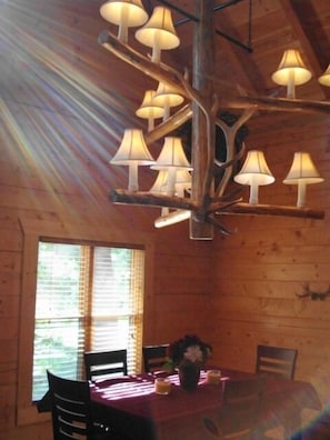 7 foot Log Chandelier is 7 foot wide, 700#s !  Gable Window above.