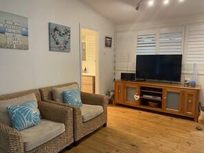 Flat screen TV, DVD and radio/CD system. Board games and DVDs in the sideboard. 