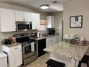 Granite counter tops, 2 stools, kitchen has just about everything you’ll need