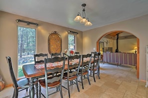 Step through the open archway to the 10-person dining table.