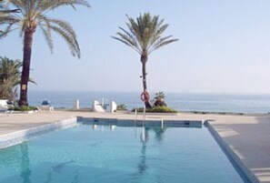 The pool overlooking the sea and beach