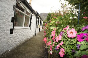 Cottage outside, path is gated and secure